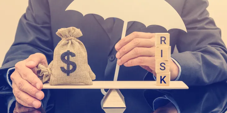 Man weighing money bag versus risk. 