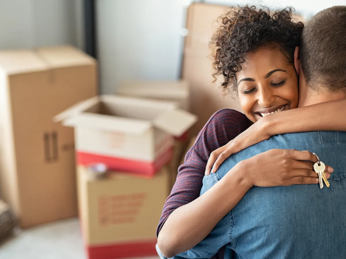 Couple Hugging Holding Home Keys