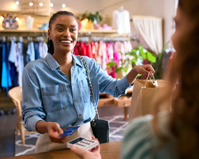 woman shopping with debit card