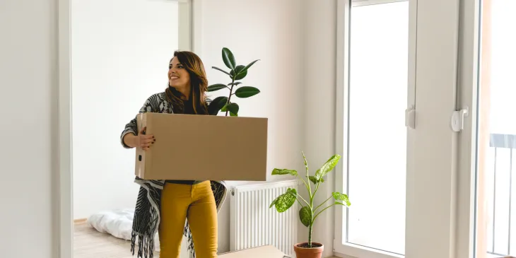 Girl Moving Boxes into New Home