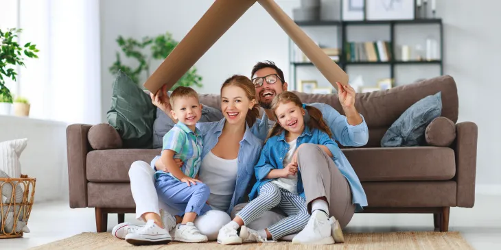 Happy Family Sitting in Living Room