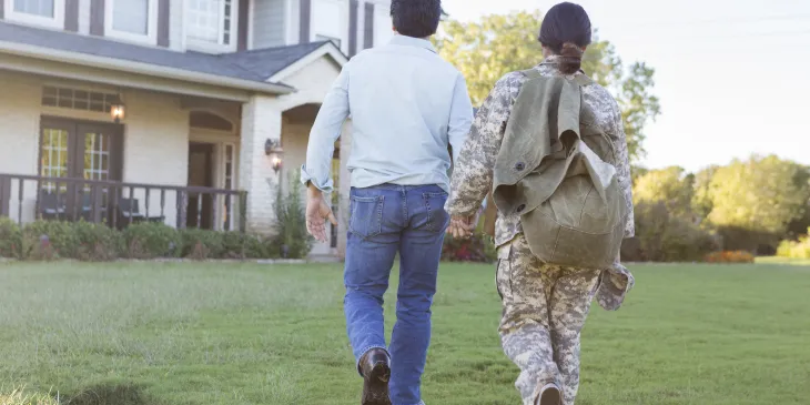 Couple walking towards new home