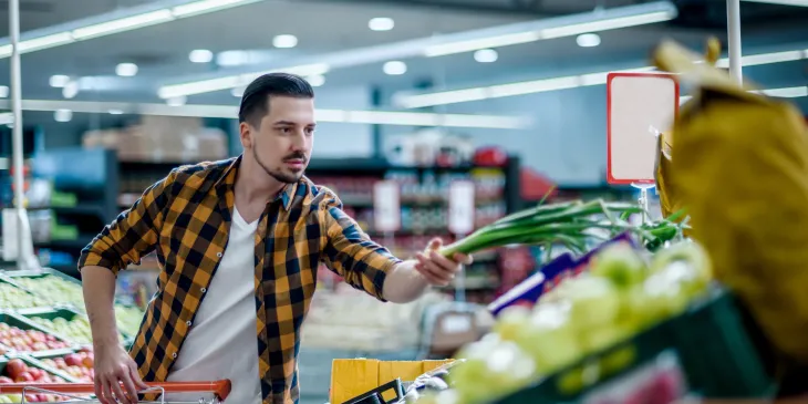 Young man grocery shopping - Extraco Banks