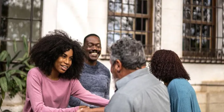 Couples shaking hands