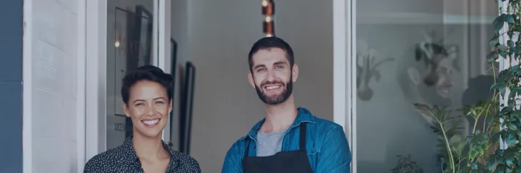 Business owners smiling