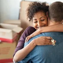 Couple Hugging Holding Home Keys