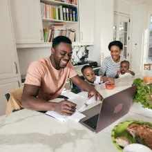 Happy Family looking over Financial paperwork