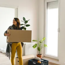 Girl Moving Boxes into New Home
