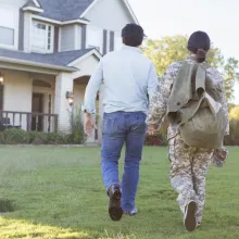 Couple walking towards new home