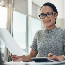 Woman working on creating a budget - Extraco Banks