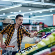 Young man grocery shopping - Extraco Banks